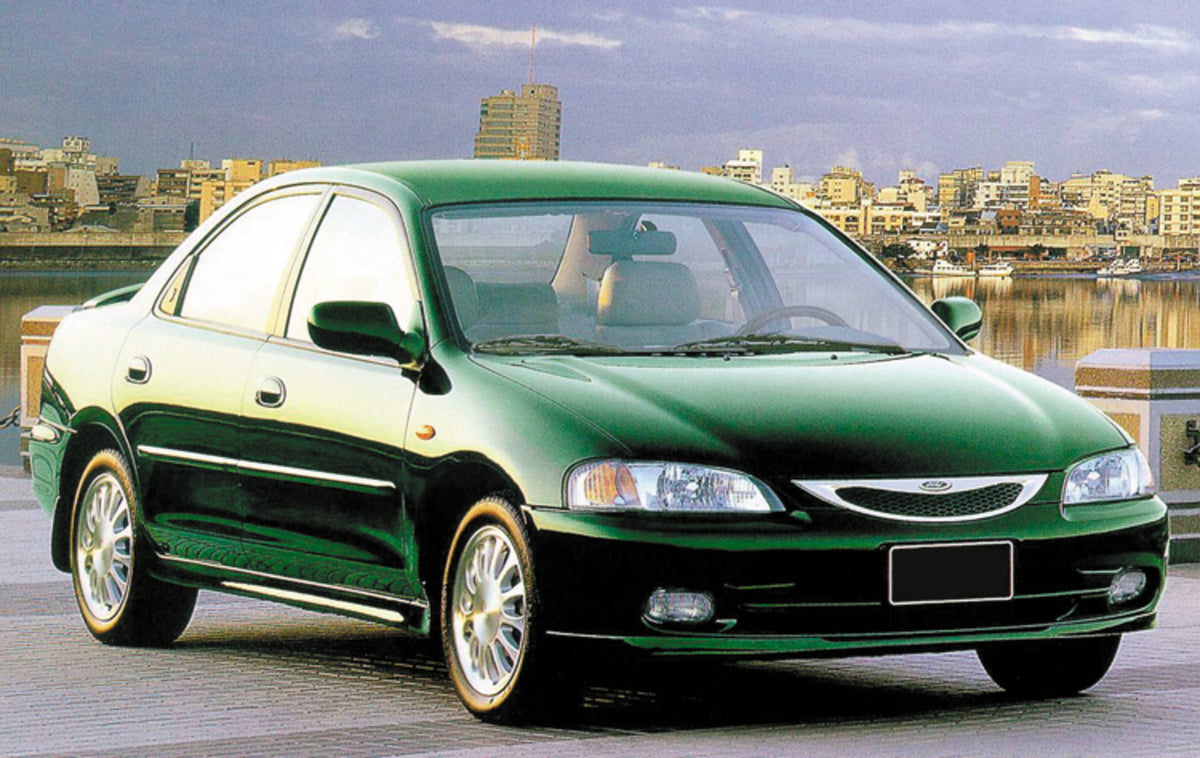 This archival image documents the 1999 Ford Tierra on scenic bridge with cityscape and is preserved in the Ford Heritage Vault as part of Ford Motor Company's historic photographic archive. Free for personal, non-commercial use. Ford Heritage Vaul...