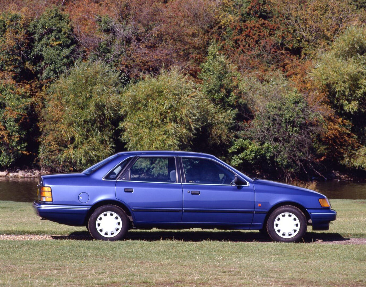 This archival image documents the 1990 Ford Granada Mark III GL side view with scenic river and fall trees and is preserved in the Ford Heritage Vault as part of Ford Motor Company's historic photographic archive. Free for personal, non-commercial...