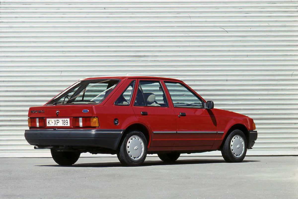 This archival image documents the 1989 Heritage Archive - 1988 Ford Escort Mark IV rear view in front of metal wall and is preserved in the Ford Heritage Vault as part of Ford Motor Company's historic photographic archive. Free for personal, non-c...