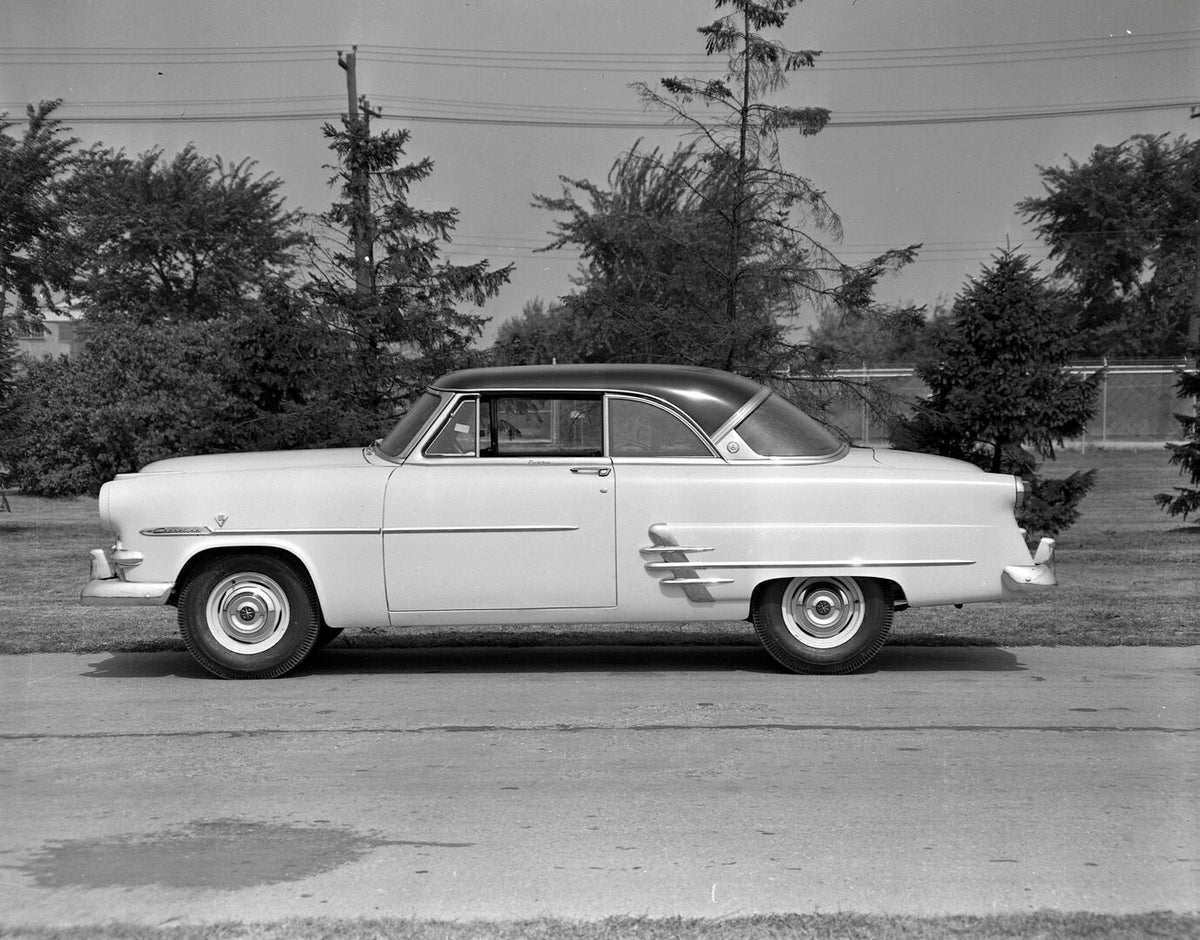 This archival image documents the 1953 Meteor Crestline Victoria Coupe side view on scenic road AR-2007-5 and is preserved in the Ford Heritage Vault as part of Ford Motor Company's historic photographic archive. Free for personal, non-commercial ...