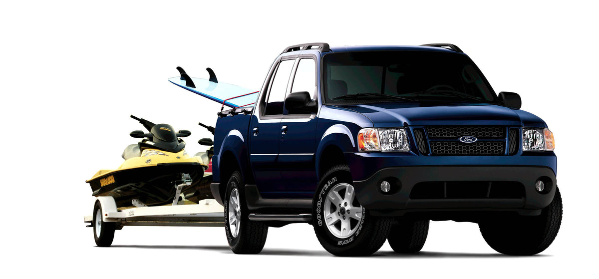 This archival image documents the 2005 Ford Explorer Sport Trac towing boat and is preserved in the Ford Heritage Vault as part of Ford Motor Company's historic photographic archive. Free for personal, non-commercial use. Ford Heritage Vault refer...