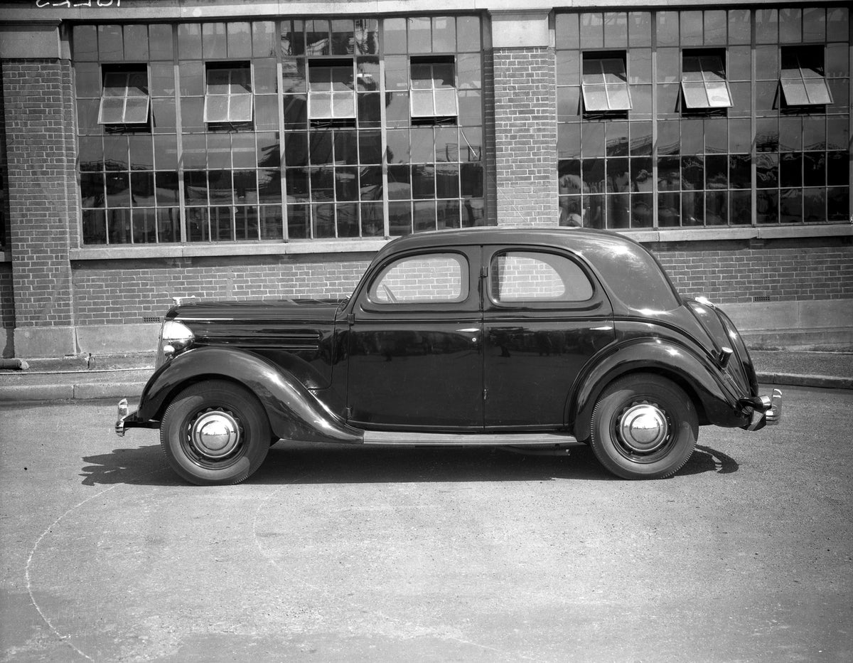 This archival image documents the 1947 Ford Pilot side view in front of building 18E 23 and is preserved in the Ford Heritage Vault as part of Ford Motor Company's historic photographic archive. Free for personal, non-commercial use. Ford Heritage...