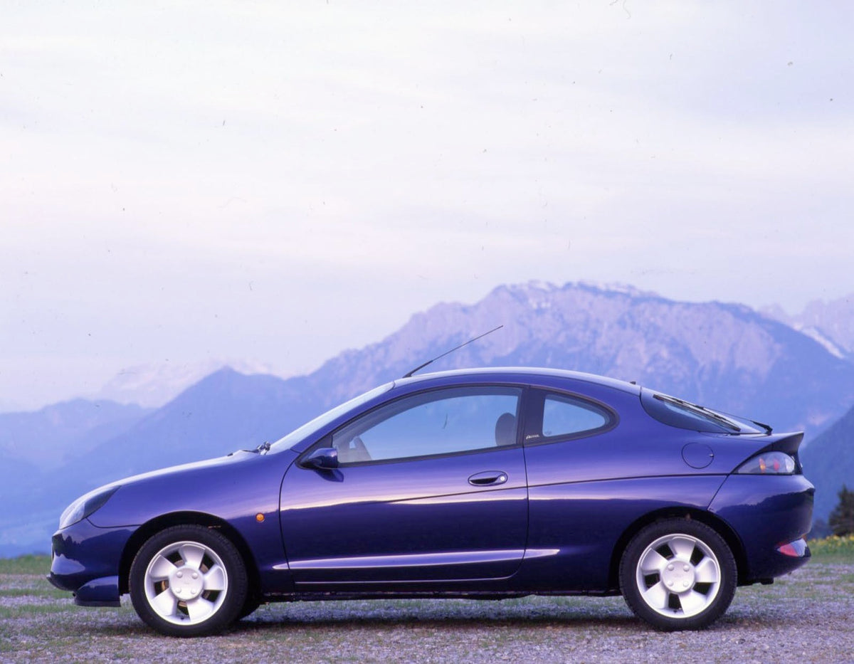 This archival image documents the 1997 Ford Puma LHD side view with scenic mountains in Germany and is preserved in the Ford Heritage Vault as part of Ford Motor Company's historic photographic archive. Free for personal, non-commercial use. Ford ...