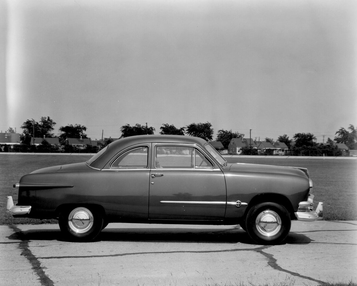 This archival image documents the 1951 Meteor Coupe side view on road with houses in distance AR-2007-5 and is preserved in the Ford Heritage Vault as part of Ford Motor Company's historic photographic archive. Free for personal, non-commercial us...