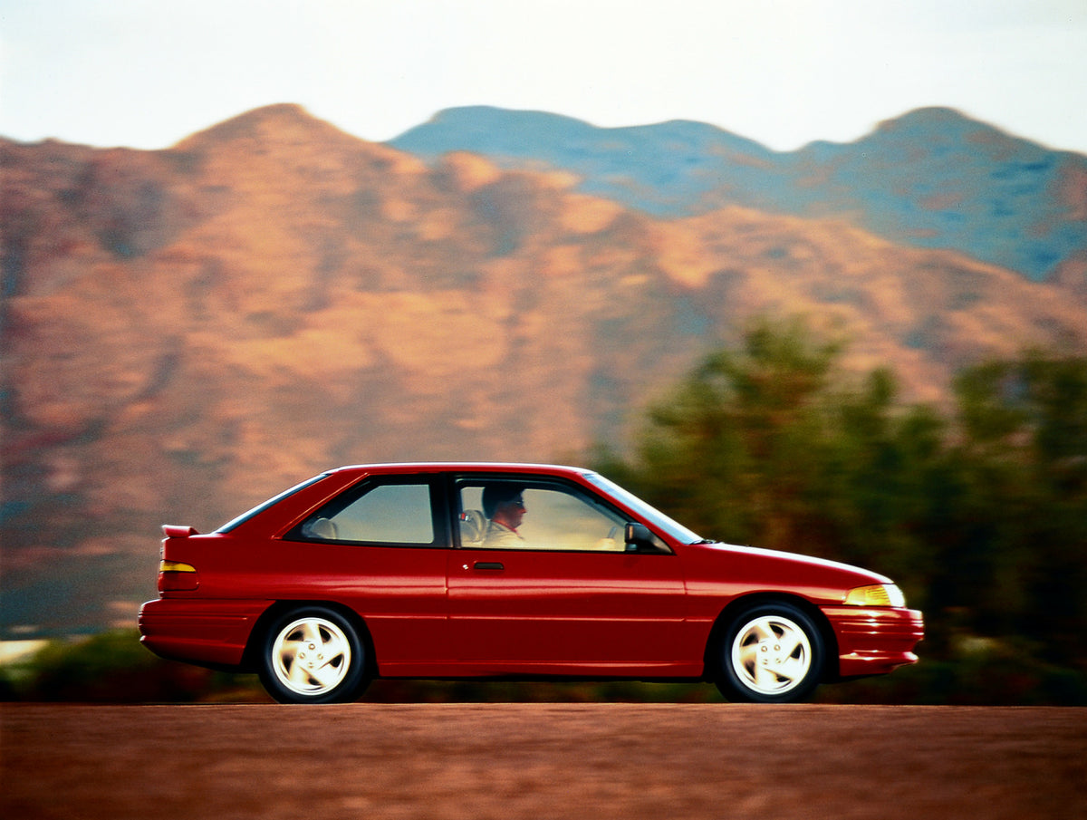 This archival image documents the 1993 Ford Escort two-door and is preserved in the Ford Heritage Vault as part of Ford Motor Company's historic photographic archive. Free for personal, non-commercial use. Ford Heritage Vault reference AR-2001-94-...