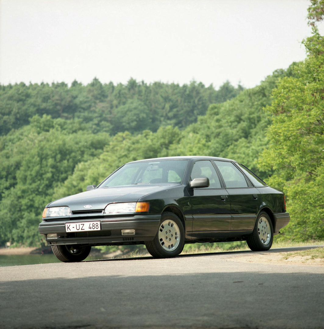 This archival image documents the 1985 Ford Scorpio Mark I 4 Wheel Drive LHD with scenic trees and is preserved in the Ford Heritage Vault as part of Ford Motor Company's historic photographic archive. Free for personal, non-commercial use. Ford H...