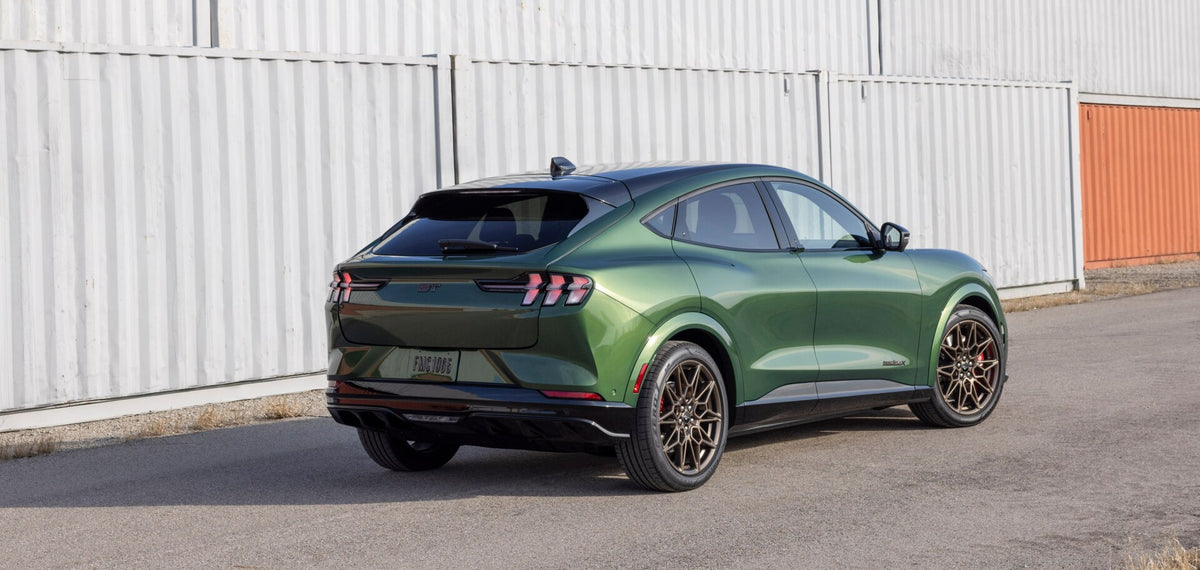 This archival image documents the 2024 Ford Mustang Mach-E rear view with shipping containers and is preserved in the Ford Heritage Vault as part of Ford Motor Company's historic photographic archive. Free for personal, non-commercial use. Ford He...
