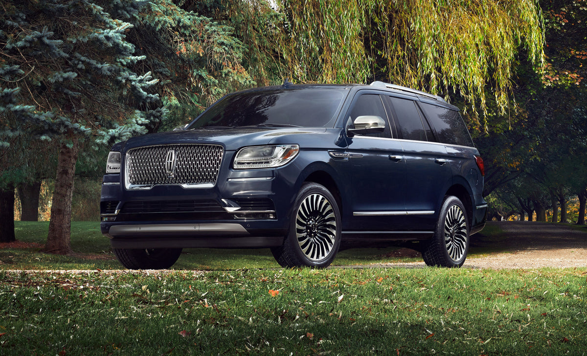 This archival image documents the 2019 Lincoln Navigator Black Label with scenic trees and is preserved in the Ford Heritage Vault as part of Ford Motor Company's historic photographic archive. Free for personal, non-commercial use. Ford Heritage ...
