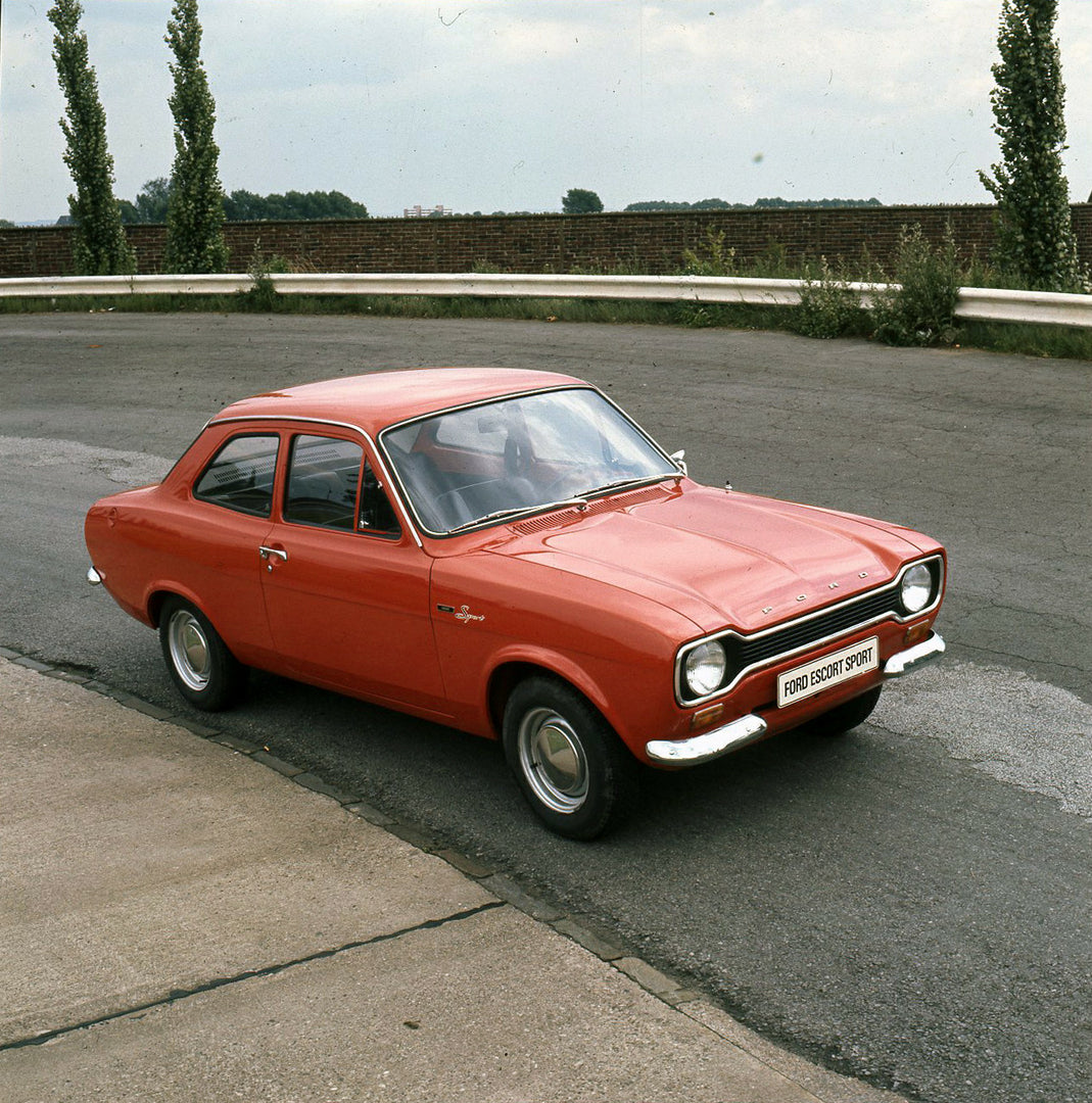 This archival image documents the 1972 Ford Escort Mark I on scenic road and is preserved in the Ford Heritage Vault as part of Ford Motor Company's historic photographic archive. Free for personal, non-commercial use. Ford Heritage Vault referenc...