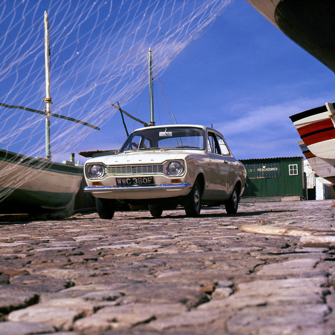 This archival image documents the 1967 Ford Escort Mark I Super and Deluxe lower view in scenic harbor and is preserved in the Ford Heritage Vault as part of Ford Motor Company's historic photographic archive. Free for personal, non-commercial use...