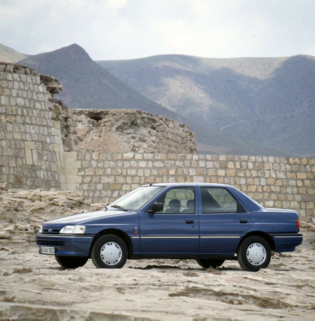 This archival image documents the 1990 Ford Orion Mark III side view with scenic ruins and is preserved in the Ford Heritage Vault as part of Ford Motor Company's historic photographic archive. Free for personal, non-commercial use. Ford Heritage ...
