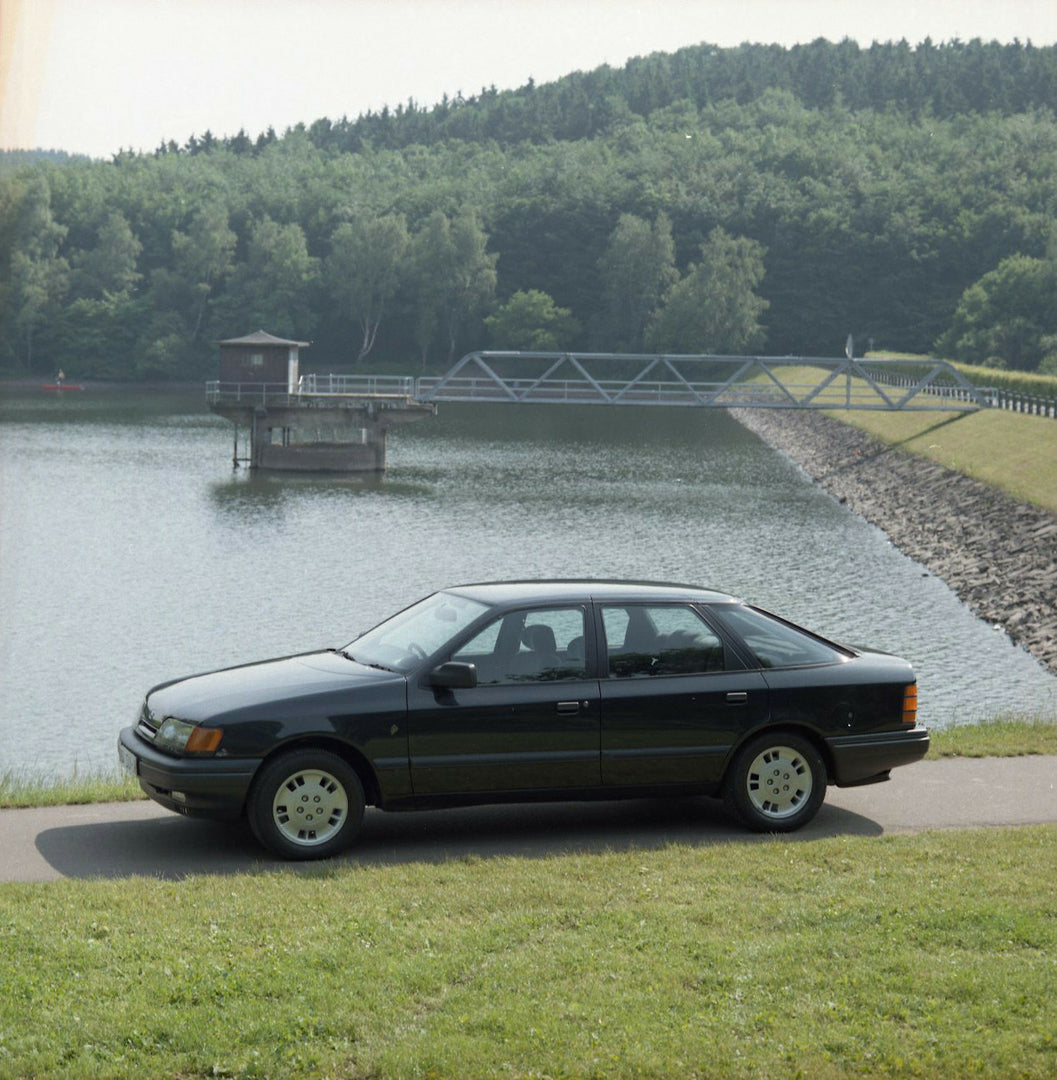 This archival image documents the 1985 Ford Scorpio Mark I 4 Wheel Drive LHD side view near scenic lake and is preserved in the Ford Heritage Vault as part of Ford Motor Company's historic photographic archive. Free for personal, non-commercial us...