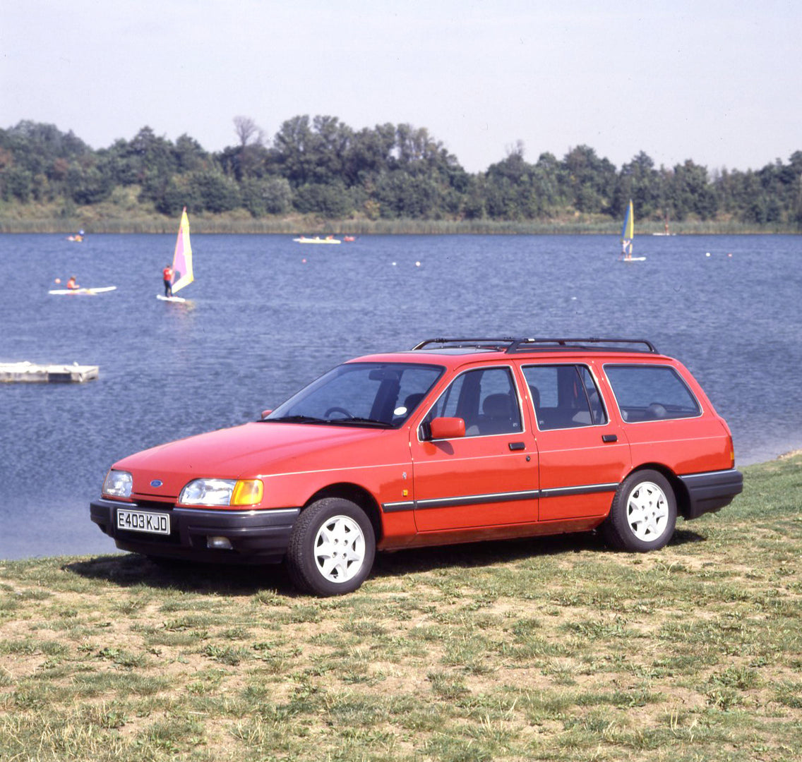 This archival image documents the 1987 Ford Sierra Mark II Ghia 4x4 Estate near scenic lake with boats and is preserved in the Ford Heritage Vault as part of Ford Motor Company's historic photographic archive. Free for personal, non-commercial use...