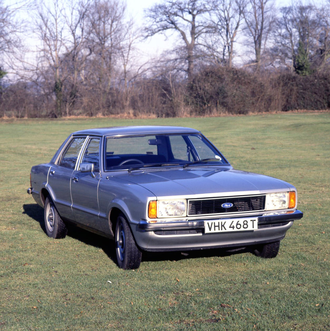 This archival image documents the 1979 Ford Cortina MK IV 1600 L 4 door in scenic field with trees and is preserved in the Ford Heritage Vault as part of Ford Motor Company's historic photographic archive. Free for personal, non-commercial use. Fo...