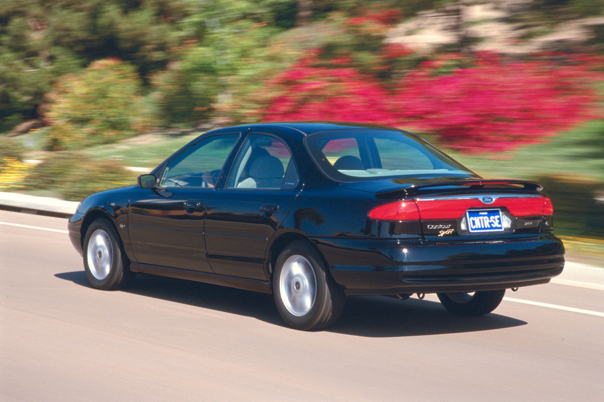 This archival image documents the 1999 Ford Contour Sport and is preserved in the Ford Heritage Vault as part of Ford Motor Company's historic photographic archive. Free for personal, non-commercial use. Ford Heritage Vault reference AR-2008-8.1.2...