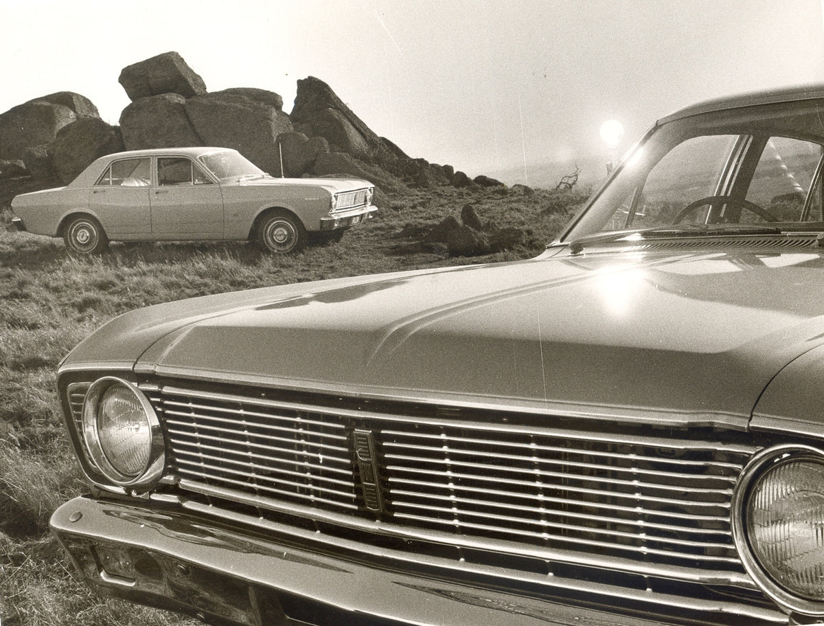 This archival image documents the 1968 Ford XT Falcons front closeup and side view in scenic field with rock formation and is preserved in the Ford Heritage Vault as part of Ford Motor Company's historic photographic archive. Free for personal, no...
