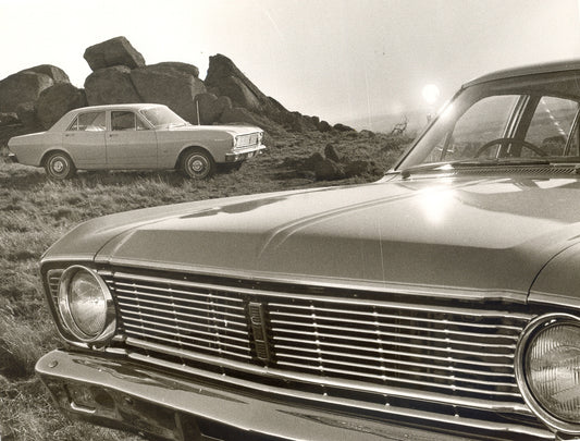 1968 Ford XT Falcons front closeup and side view in scenic field with rock formation HV 1968-0107