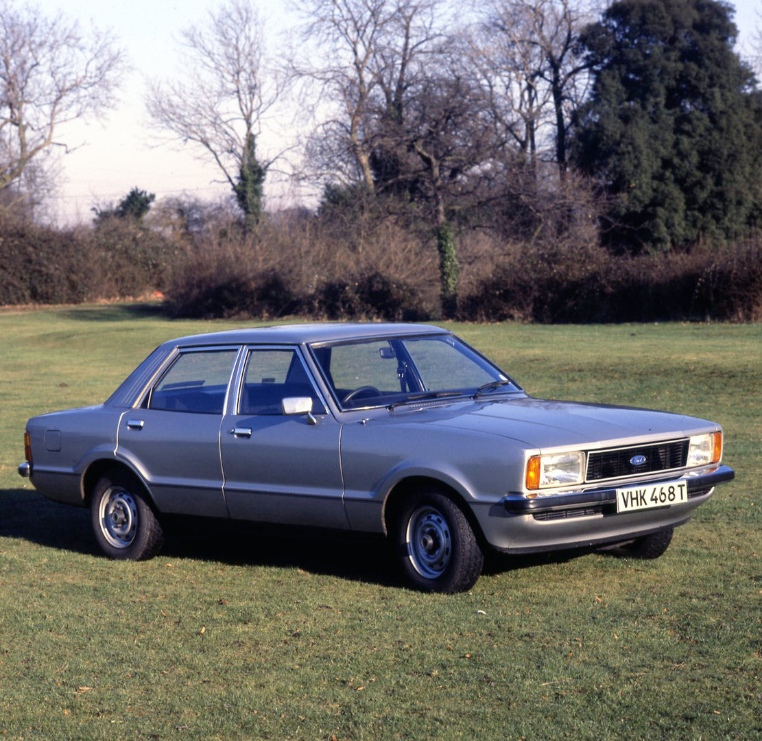 This archival image documents the 1979 Ford Cortina MK IV 1600 L 4 door in scenic field with trees and is preserved in the Ford Heritage Vault as part of Ford Motor Company's historic photographic archive. Free for personal, non-commercial use. Fo...