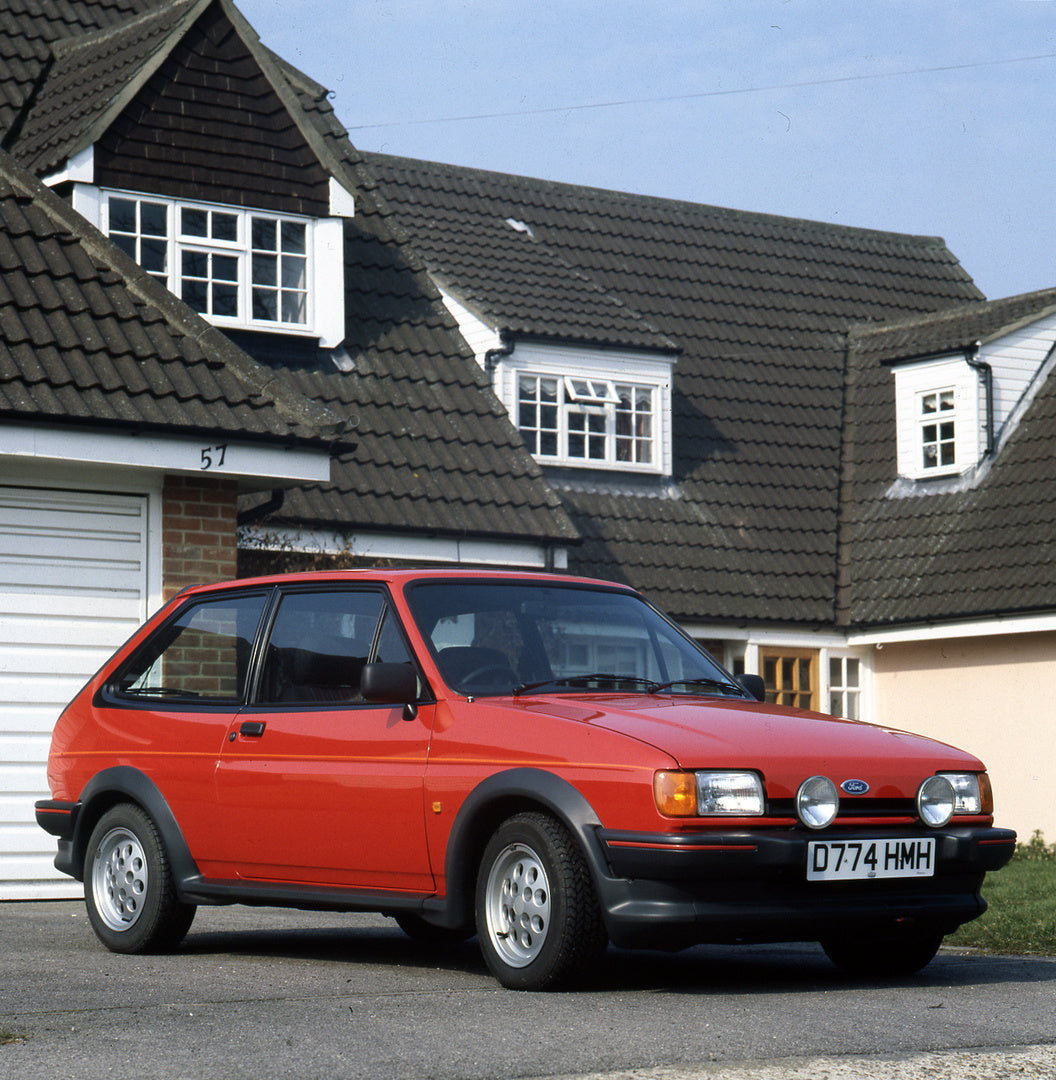 This archival image documents the 1987 Ford Fiesta Mark II XR2 in front of scenic house and is preserved in the Ford Heritage Vault as part of Ford Motor Company's historic photographic archive. Free for personal, non-commercial use. Ford Heritage...