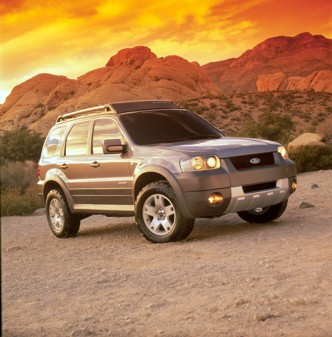 This archival image documents the 2001 Ford Escape with mountains in background and is preserved in the Ford Heritage Vault as part of Ford Motor Company's historic photographic archive. Free for personal, non-commercial use. Ford Heritage Vault r...