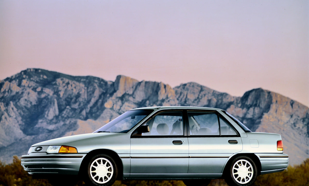 This archival image documents the 1993 Ford Escort four-door and is preserved in the Ford Heritage Vault as part of Ford Motor Company's historic photographic archive. Free for personal, non-commercial use. Ford Heritage Vault reference AR-2001-94...