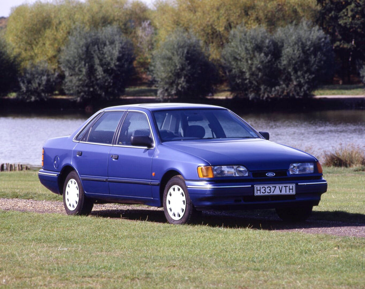 This archival image documents the 1990 Ford Granada Mark III GL with scenic river and trees and is preserved in the Ford Heritage Vault as part of Ford Motor Company's historic photographic archive. Free for personal, non-commercial use. Ford Heri...