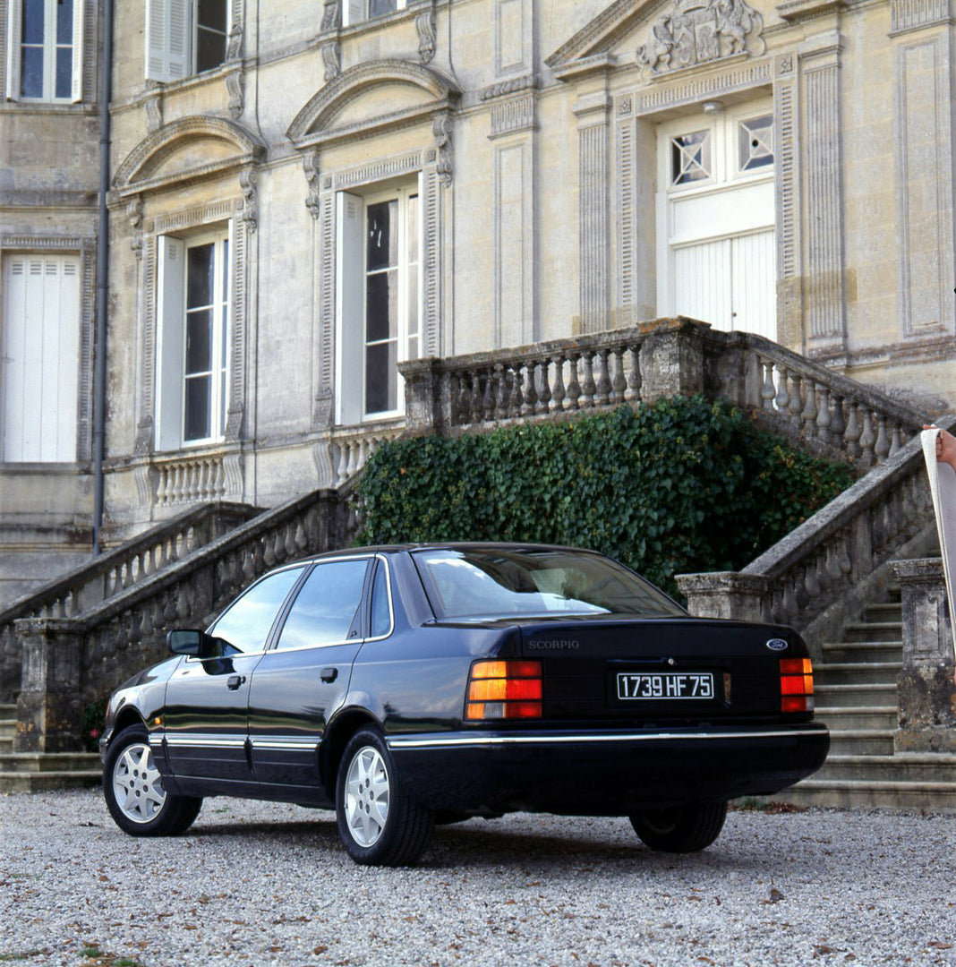 This archival image documents the 1989 Ford Scorpio Mark I rear view in front of scenic house and is preserved in the Ford Heritage Vault as part of Ford Motor Company's historic photographic archive. Free for personal, non-commercial use. Ford He...