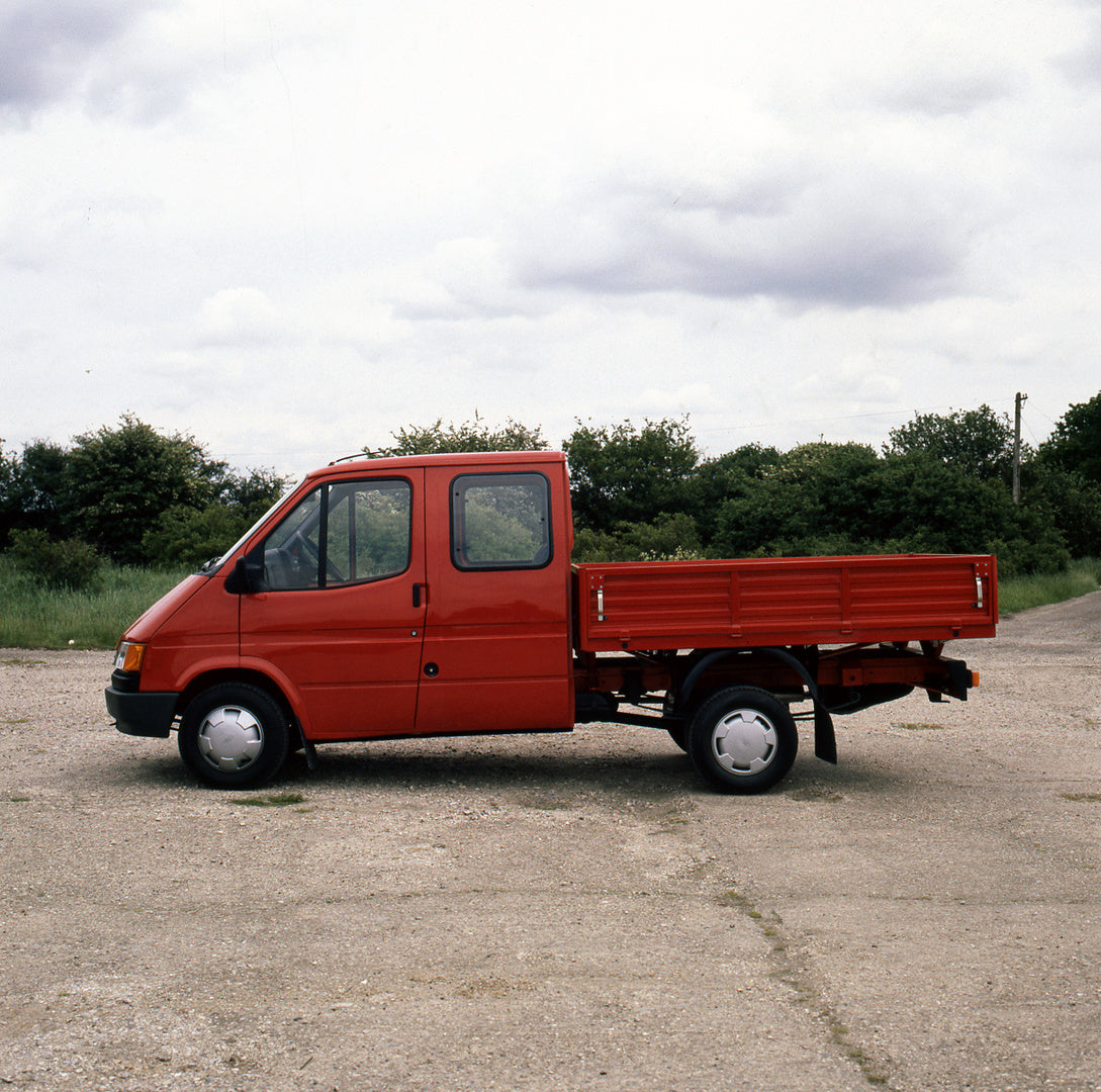 This archival image documents the 1986 Ford Transit Mark III VE 6 Double Cab Float LHD side view with trees and is preserved in the Ford Heritage Vault as part of Ford Motor Company's historic photographic archive. Free for personal, non-commercia...