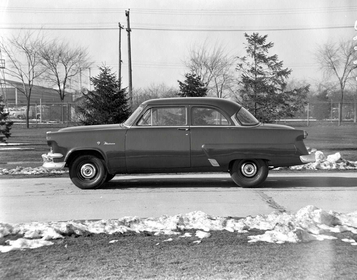 This archival image documents the 1954 Meteor Mainline Coupe side view on scenic road AR-2007-5 and is preserved in the Ford Heritage Vault as part of Ford Motor Company's historic photographic archive. Free for personal, non-commercial use. Ford ...