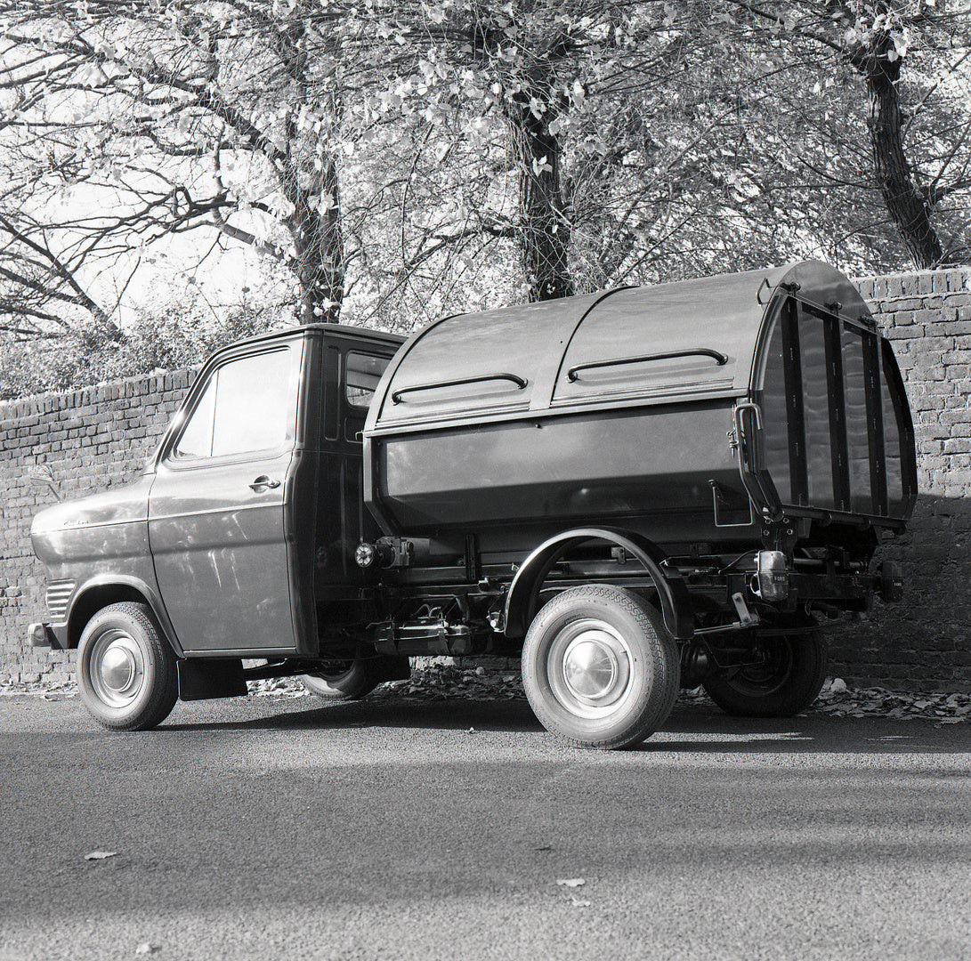 This archival image documents the 1972 Ford Transit Mark I Dustcart on scenic street and is preserved in the Ford Heritage Vault as part of Ford Motor Company's historic photographic archive. Free for personal, non-commercial use. Ford Heritage Va...