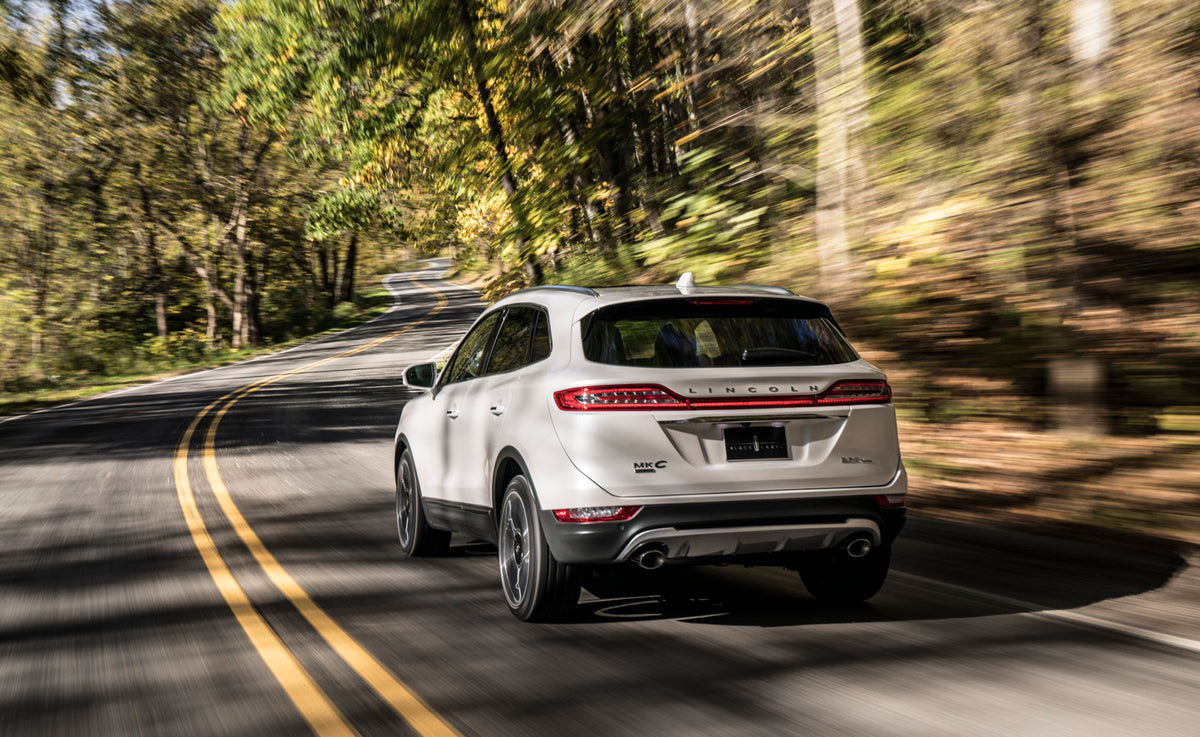 This archival image documents the 2019 Lincoln MKC action shot on scenic road and is preserved in the Ford Heritage Vault as part of Ford Motor Company's historic photographic archive. Free for personal, non-commercial use. Ford Heritage Vault ref...