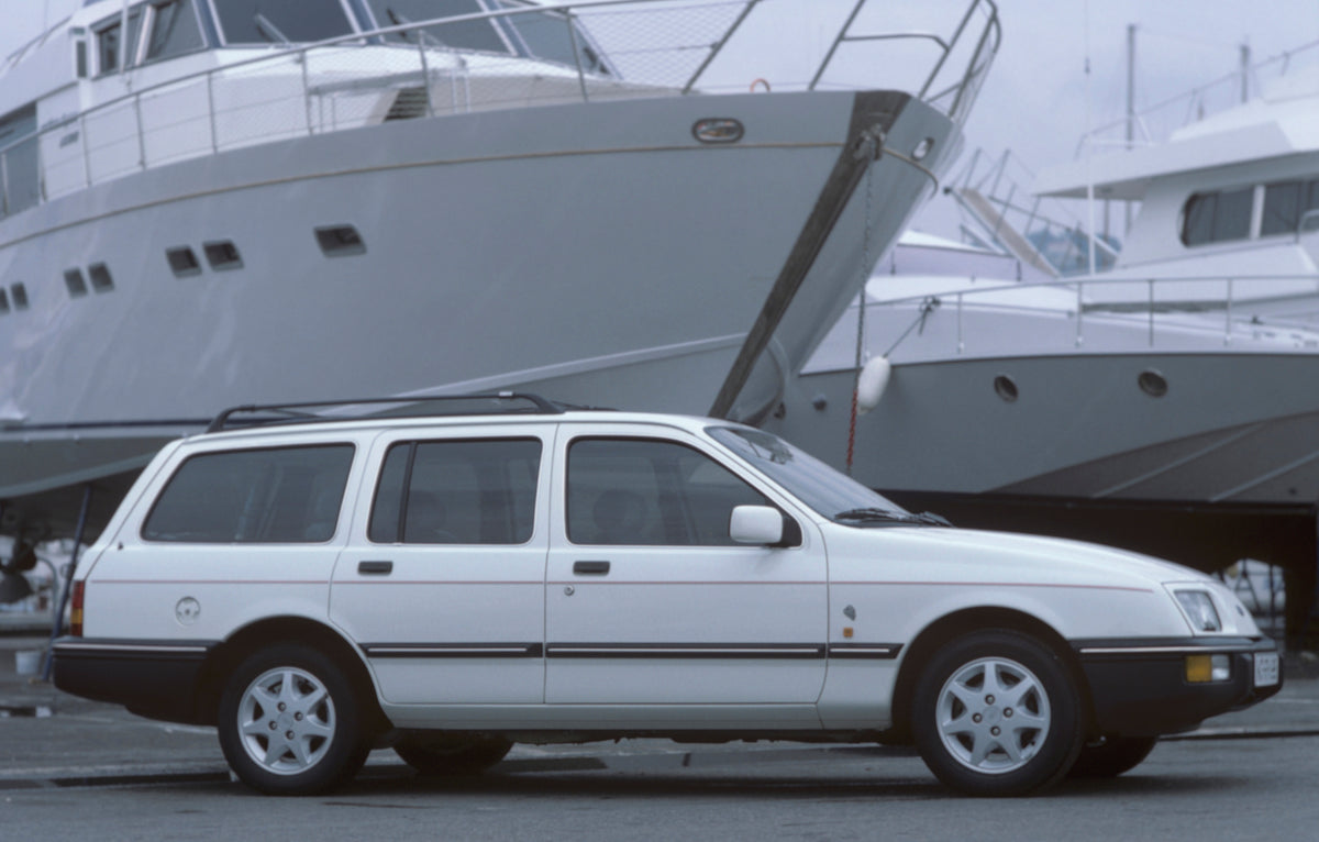This archival image documents the 1985 Ford Sierra L 4x4 side view with boats and is preserved in the Ford Heritage Vault as part of Ford Motor Company's historic photographic archive. Free for personal, non-commercial use. Ford Heritage Vault ref...