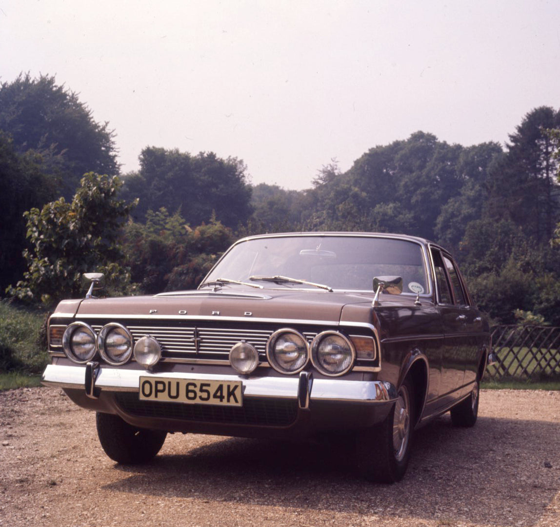 This archival image documents the 1971 Ford Zodiac Mark VI Executive front view with scenic trees and is preserved in the Ford Heritage Vault as part of Ford Motor Company's historic photographic archive. Free for personal, non-commercial use. For...