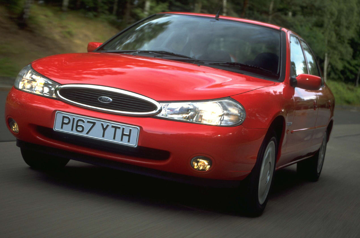 This archival image documents the 1996 Ford Mondeo Mark I Si closeup action shot on scenic road AR-2002-213709 and is preserved in the Ford Heritage Vault as part of Ford Motor Company's historic photographic archive. Free for personal, non-commer...