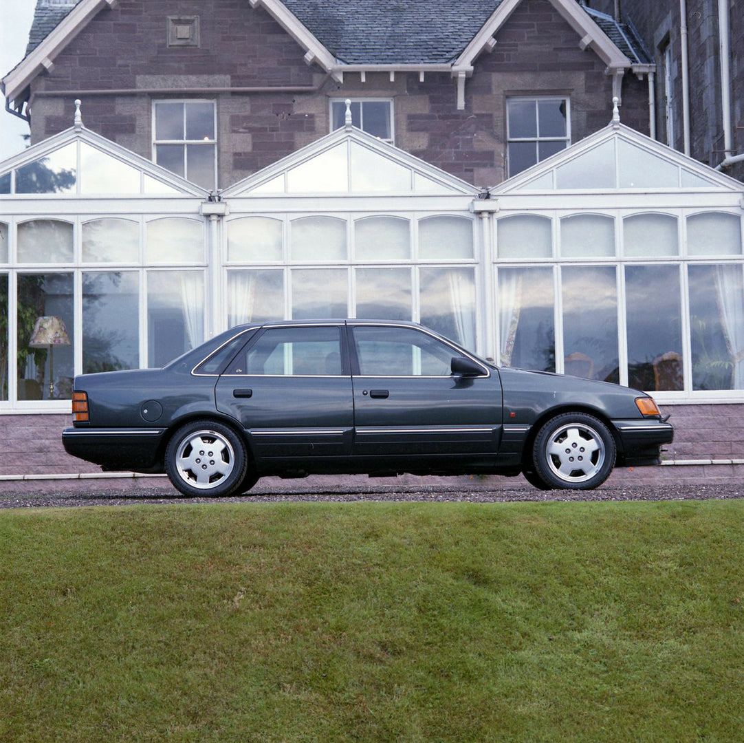 This archival image documents the 1990 Ford Scorpio Cosworth 24 Valve Mark I in front of building and is preserved in the Ford Heritage Vault as part of Ford Motor Company's historic photographic archive. Free for personal, non-commercial use. For...