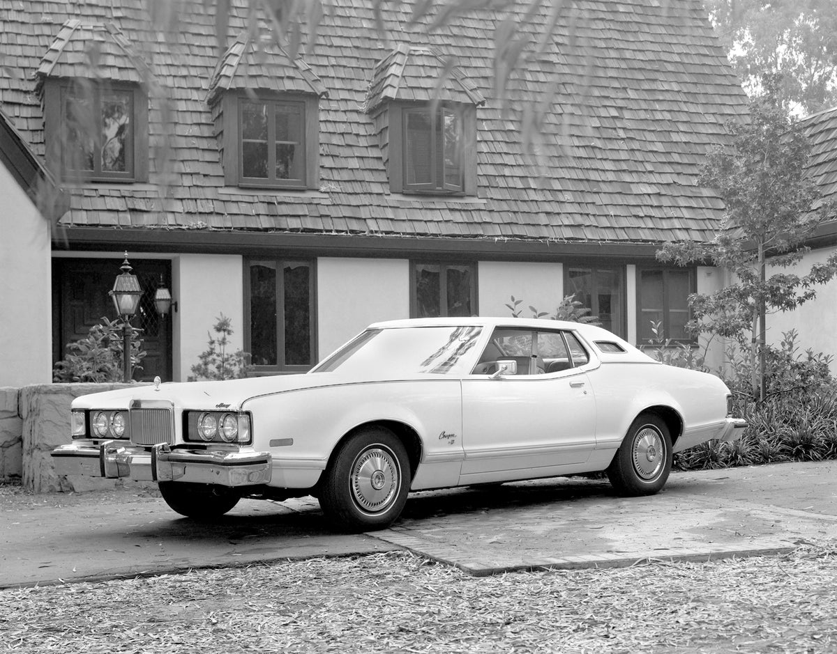 This archival image documents the 1974 Mercury Cougar XR-7 in front of a House and is preserved in the Ford Heritage Vault as part of Ford Motor Company's historic photographic archive. Free for personal, non-commercial use. Ford Heritage Vault re...