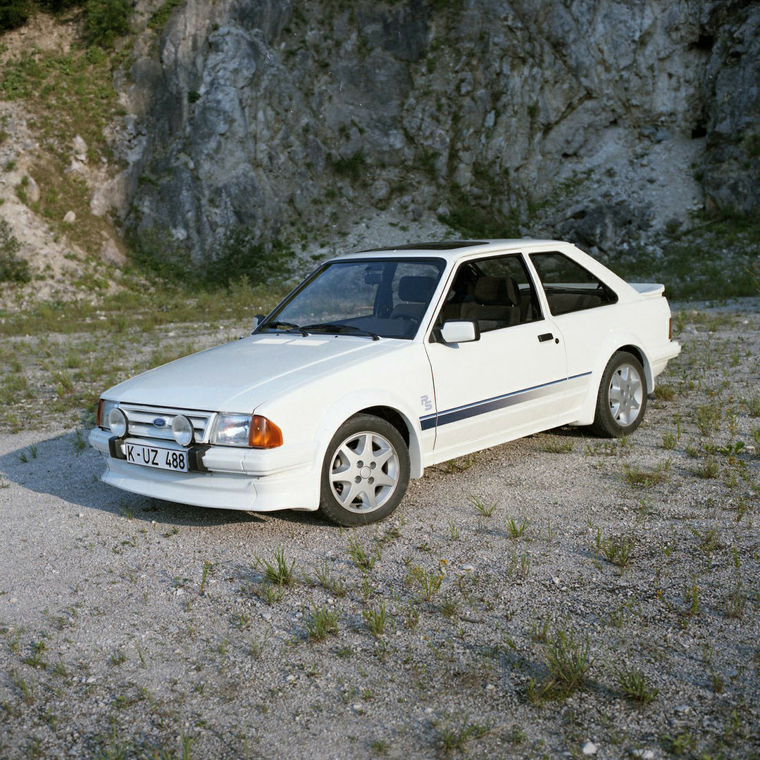 This archival image documents the 1984 Ford Escort Mark III LHD RS Turbo with scenic rock formation in Munich and is preserved in the Ford Heritage Vault as part of Ford Motor Company's historic photographic archive. Free for personal, non-commerc...