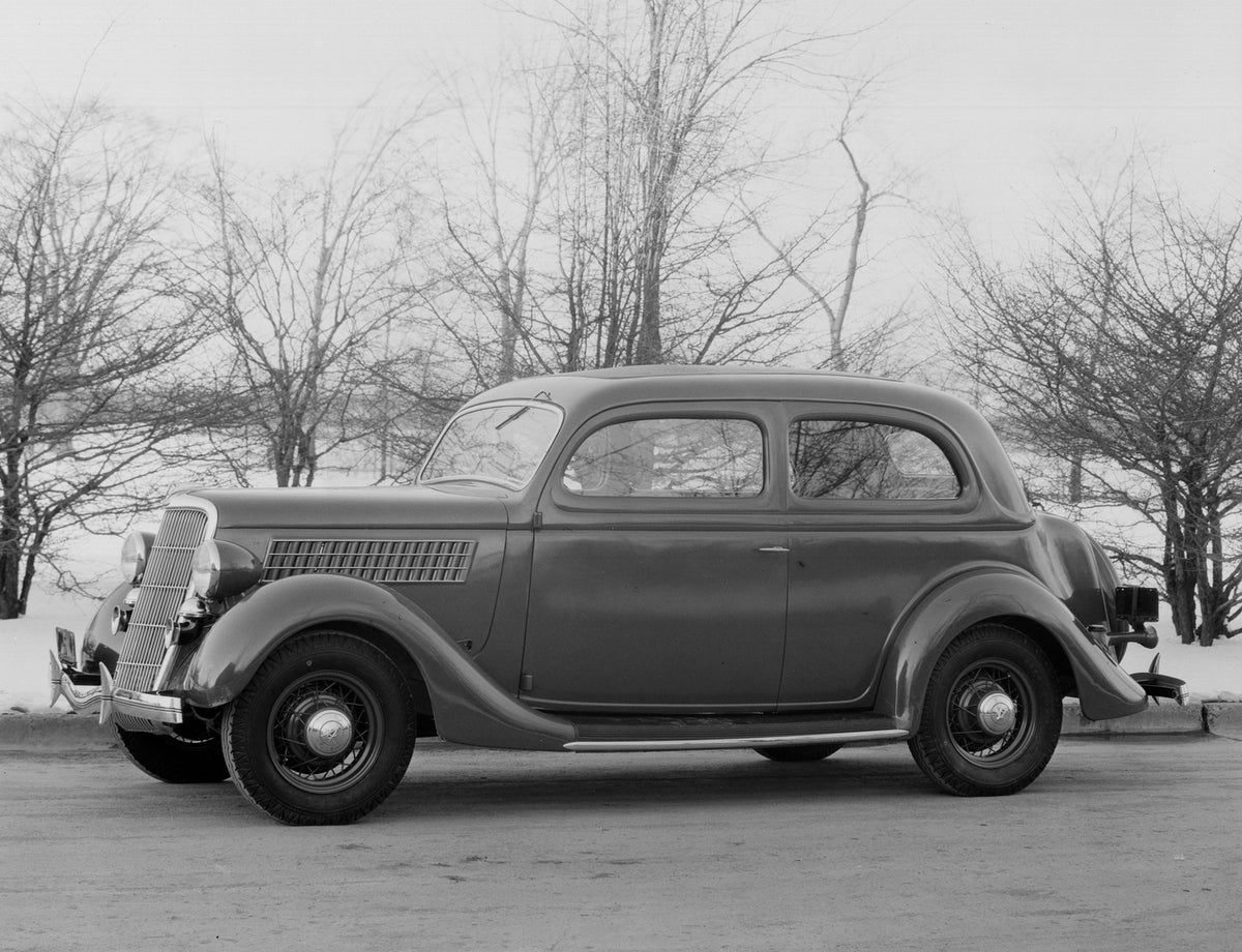 This archival image documents the 1935 Ford DeLuxe Tudor Sedan and is preserved in the Ford Heritage Vault as part of Ford Motor Company's historic photographic archive. Free for personal, non-commercial use. Ford Heritage Vault reference AR-2008-...