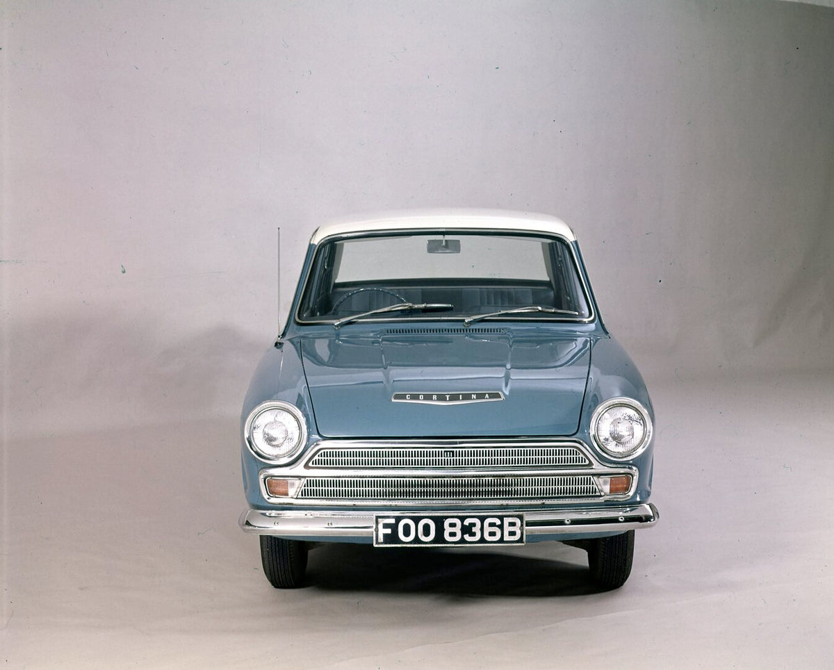 This archival image documents the 1965 Ford Cortina MK I Deluxe front view in studio and is preserved in the Ford Heritage Vault as part of Ford Motor Company's historic photographic archive. Free for personal, non-commercial use. Ford Heritage Va...