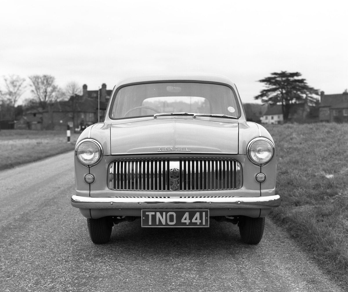 This archival image documents the 1951 Ford Consul front view on scenic road and is preserved in the Ford Heritage Vault as part of Ford Motor Company's historic photographic archive. Free for personal, non-commercial use. Ford Heritage Vault refe...