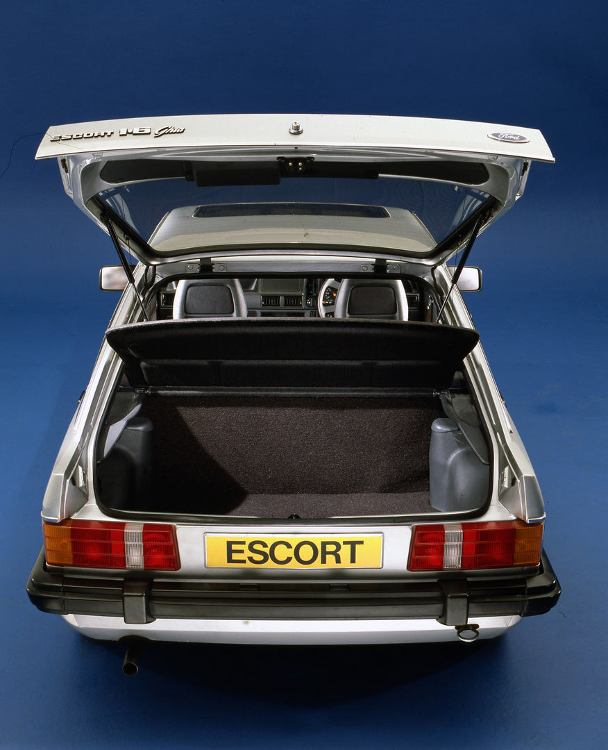 This archival image documents the 1980 Ford Escort Mark II 1.6 Ghia rear view with open trunk in studio and is preserved in the Ford Heritage Vault as part of Ford Motor Company's historic photographic archive. Free for personal, non-commercial us...