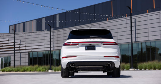 2023 Lincoln Corsair Reserve rear view in front of building HV 2023-0023