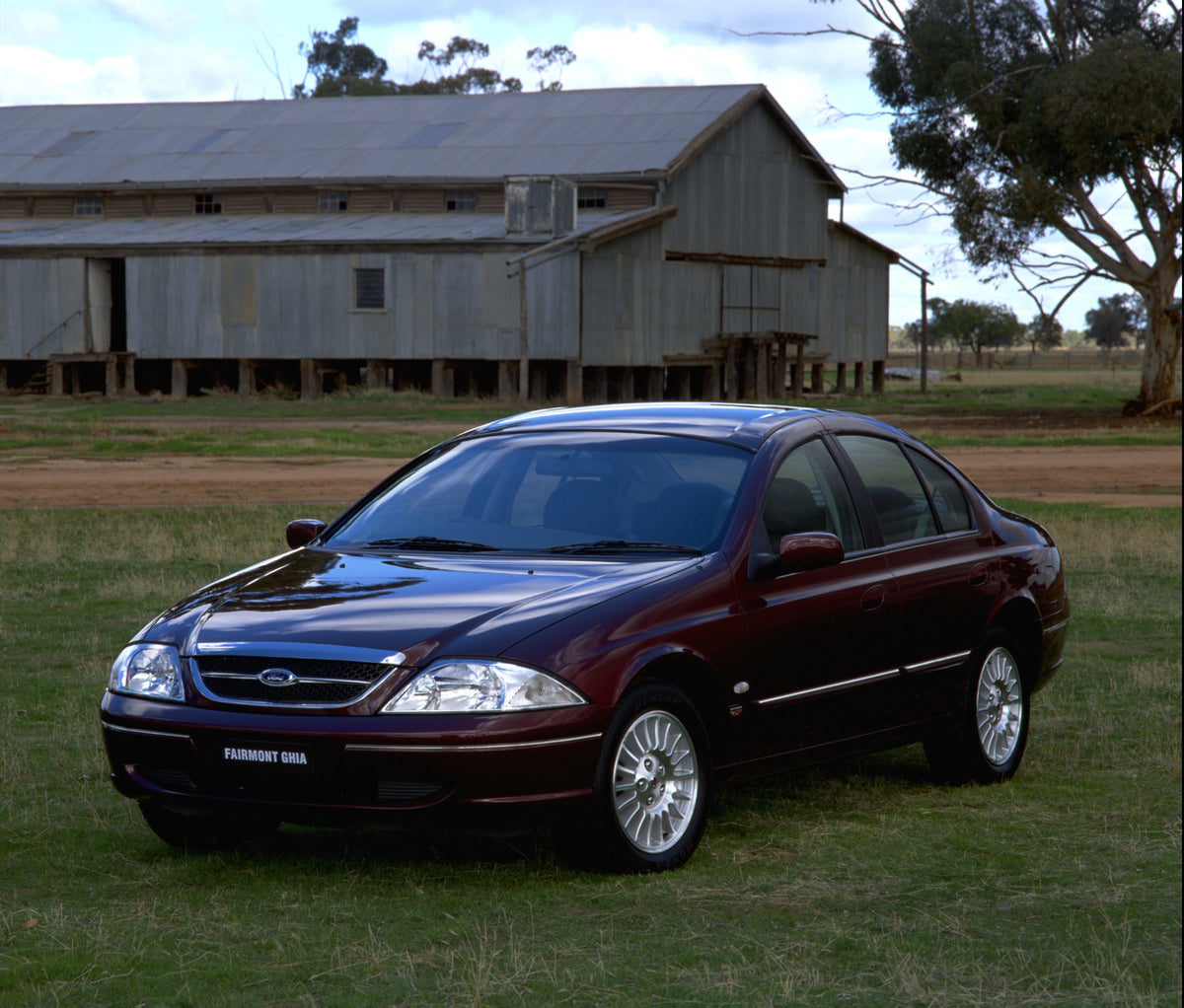 This archival image documents the 1998 Ford Falcon Fairmont Ghia in scenic field with barn and is preserved in the Ford Heritage Vault as part of Ford Motor Company's historic photographic archive. Free for personal, non-commercial use. Ford Herit...