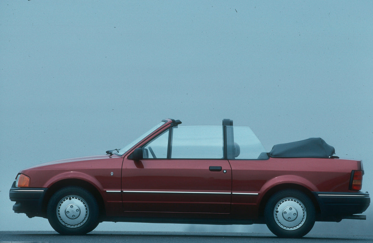 This archival image documents the 1987 Ford Escort Mark IV side view in studio Escort_Cabrio_Ghia_1987_03 and is preserved in the Ford Heritage Vault as part of Ford Motor Company's historic photographic archive. Free for personal, non-commercial ...