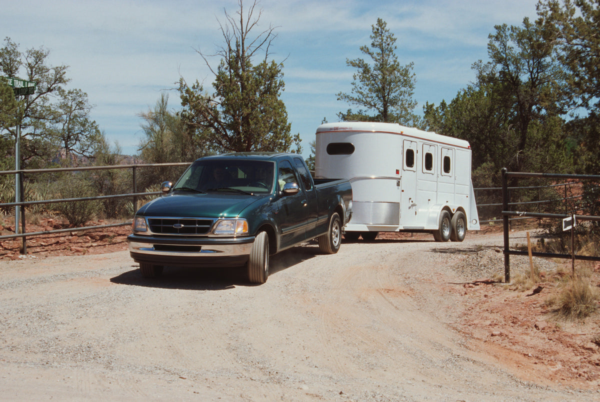 This archival image documents the 1997 Ford F-250 SuperCab pickup truck towing trailer and is preserved in the Ford Heritage Vault as part of Ford Motor Company's historic photographic archive. Free for personal, non-commercial use. Ford Heritage ...