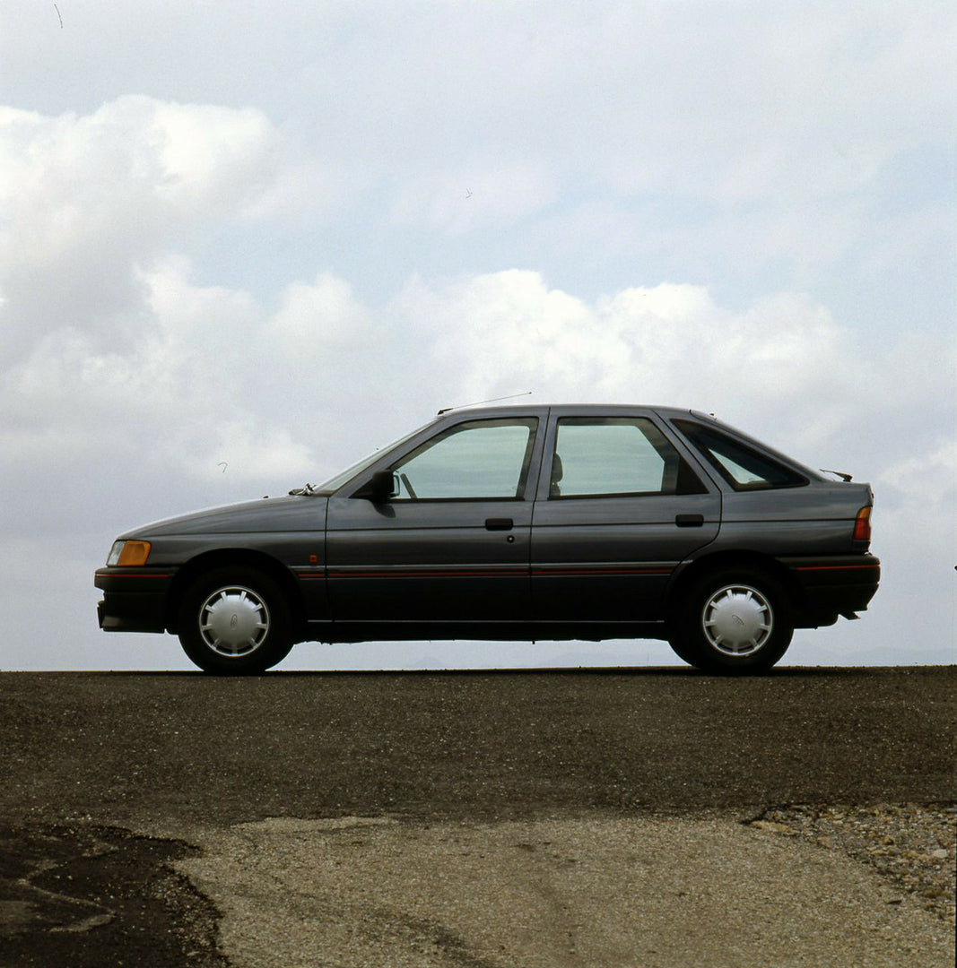 This archival image documents the 1990 Ford Escort CE-14 LHD on road in Spain and is preserved in the Ford Heritage Vault as part of Ford Motor Company's historic photographic archive. Free for personal, non-commercial use. Ford Heritage Vault ref...