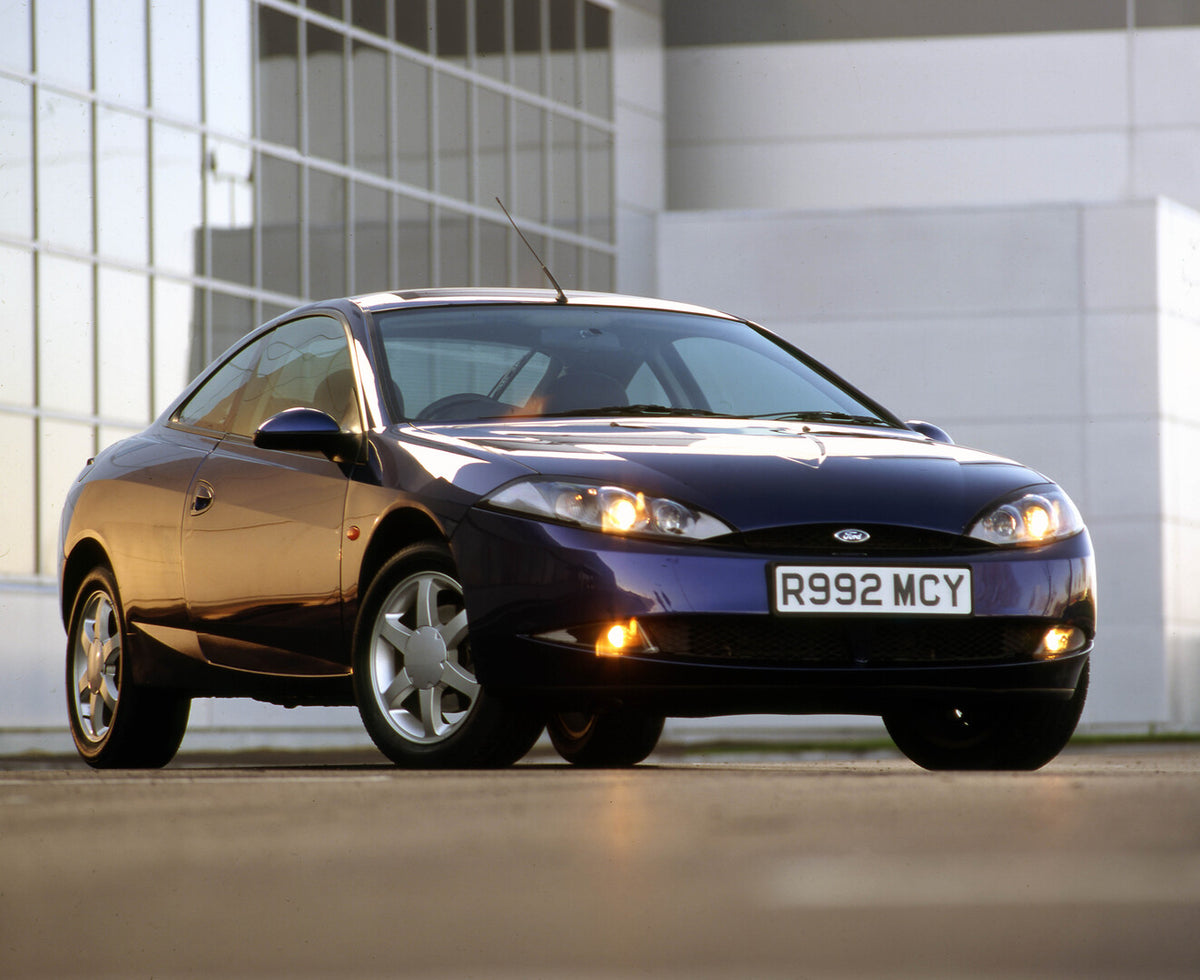 This archival image documents the 1998 Ford Cougar front 3/4 view on location and is preserved in the Ford Heritage Vault as part of Ford Motor Company's historic photographic archive. Free for personal, non-commercial use. Ford Heritage Vault ref...