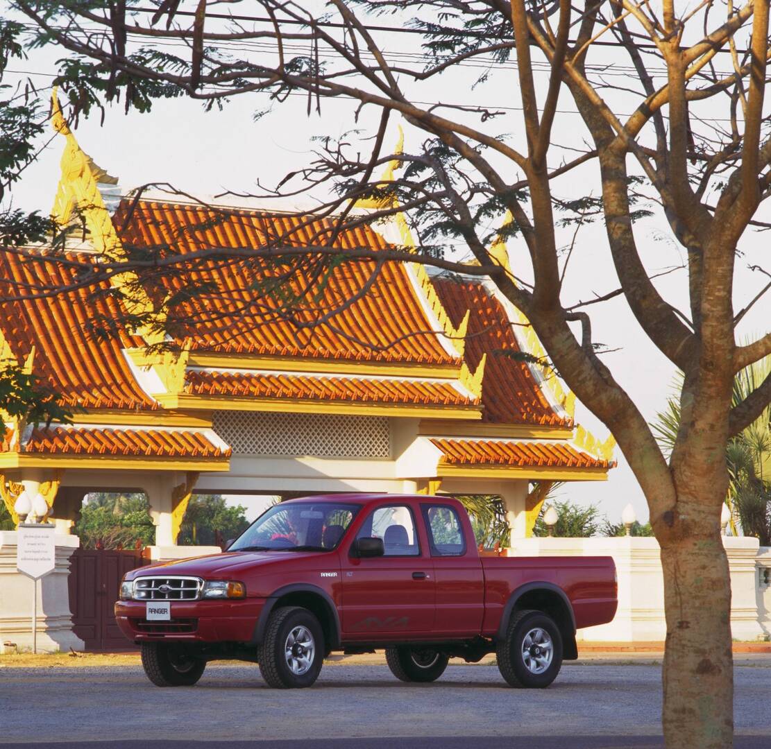 This archival image documents the 1998 Ford Thai Ranger in front of scenic building AR-2002-213709 and is preserved in the Ford Heritage Vault as part of Ford Motor Company's historic photographic archive. Free for personal, non-commercial use. Fo...