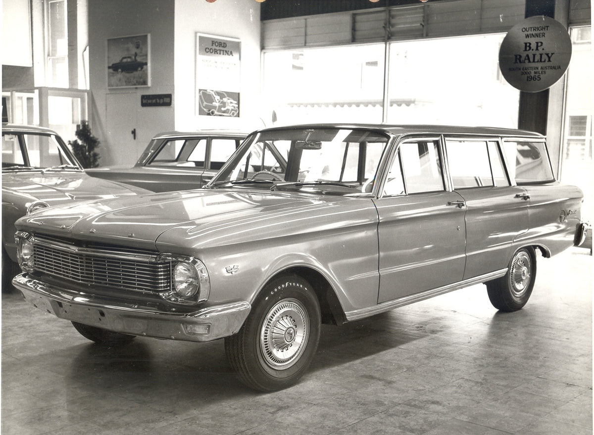 This archival image documents the 1965 Ford XP Falcon Station Wagon at dealership and is preserved in the Ford Heritage Vault as part of Ford Motor Company's historic photographic archive. Free for personal, non-commercial use. Ford Heritage Vault...