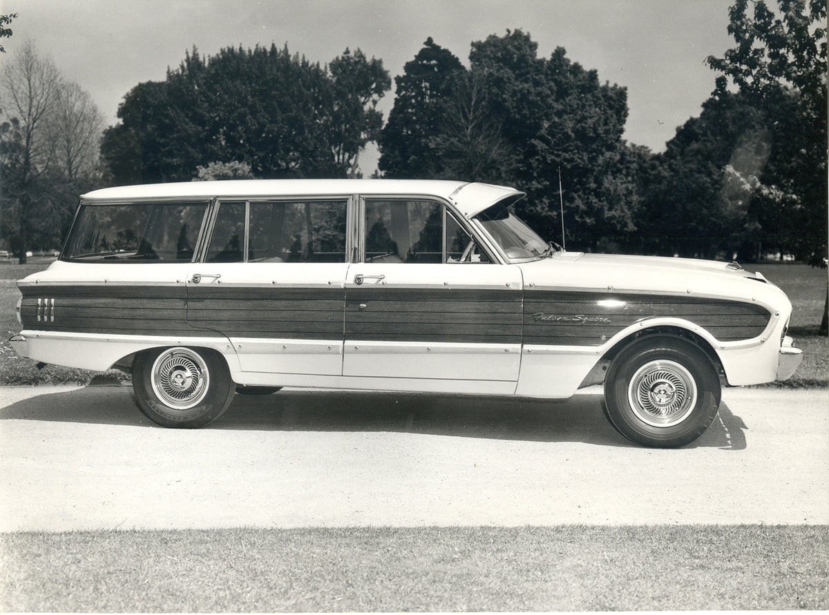 This archival image documents the 1962 Ford XL Falcon Squire Station Wagon side view with scenic trees and is preserved in the Ford Heritage Vault as part of Ford Motor Company's historic photographic archive. Free for personal, non-commercial use...